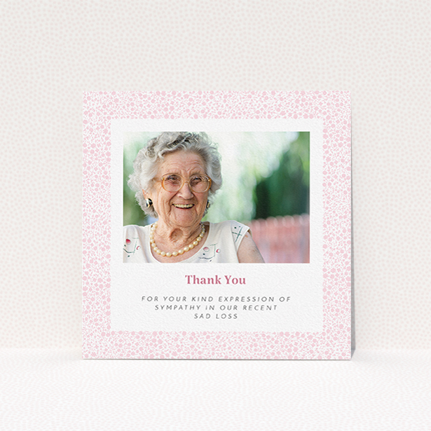 A funeral thank you card design titled "Floral Remembrance". It is a square (148mm x 148mm) card in a square orientation. It is a photographic funeral thank you card with room for 1 photo. "Floral Remembrance" is available as a flat card, with tones of pink and white.
