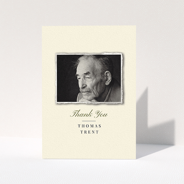A funeral thank you card design called "Out of the photo album". It is an A6 card in a portrait orientation. It is a photographic funeral thank you card with room for 1 photo. "Out of the photo album" is available as a folded card, with tones of cream and gold.