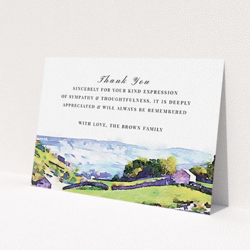A funeral thank you card design named 'Rolling down the valley'. It is an A6 card in a landscape orientation. 'Rolling down the valley' is available as a flat card, with tones of white, blue and green.