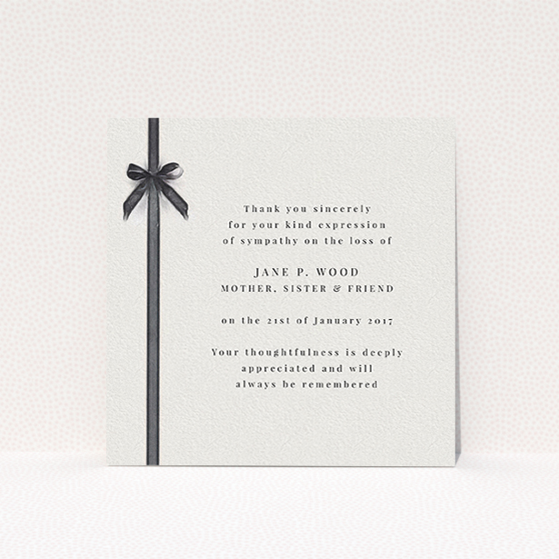A funeral thank you card design named "Tied gracefully". It is a square (148mm x 148mm) card in a square orientation. "Tied gracefully" is available as a flat card, with tones of pale cream and faded black.