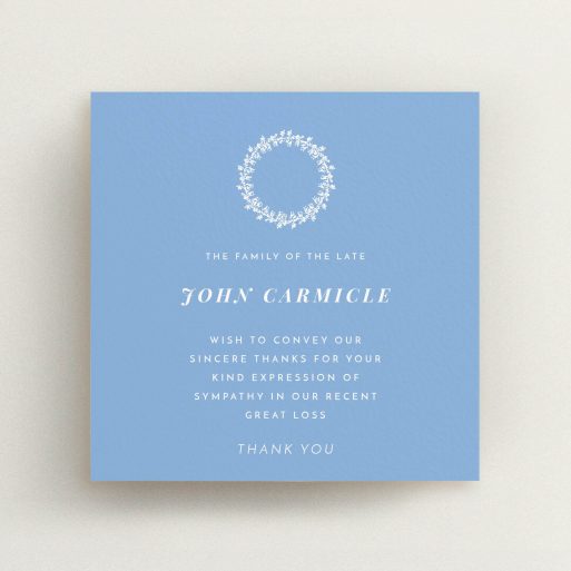 Funeral Thank You Card Design - "White Wreath in Blue" A funeral thank you card design named "White Wreath in Blue". It is a square (148mm x 148mm) card in a square orientation. "White Wreath in Blue" is available as a flat card, with tones of blue and white.