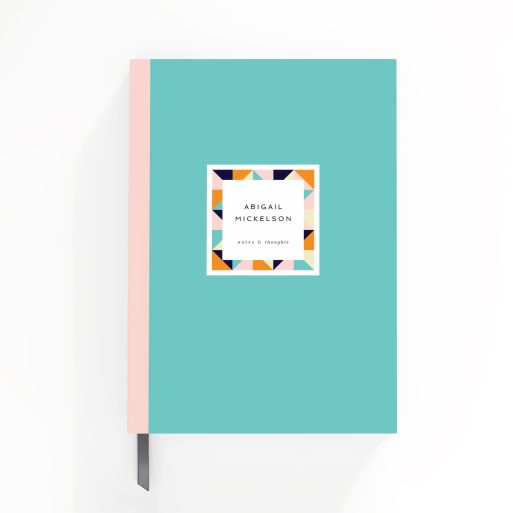 Colourful portrait notebook design with geometric pattern on front cover, featuring one photo placeholder.