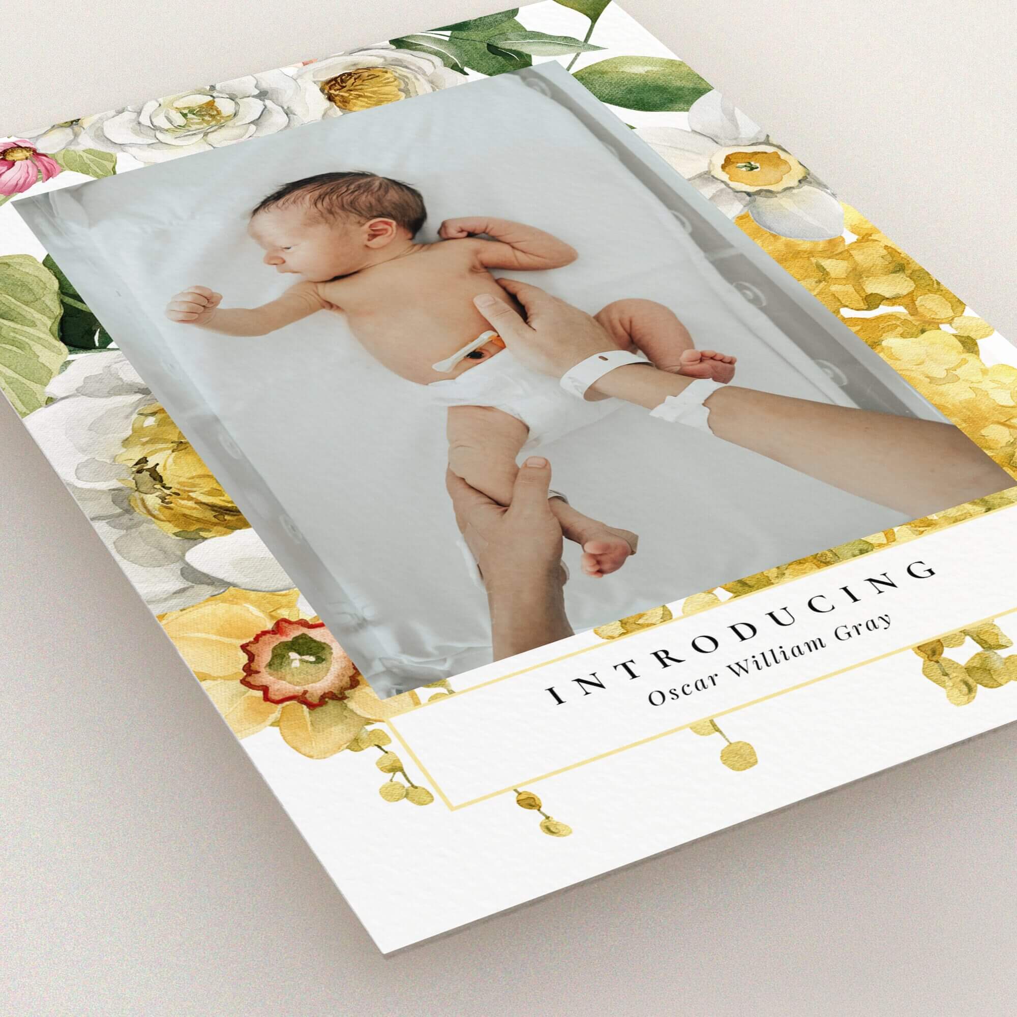 Floral design birth announcement card with one baby photo and elegant typography.