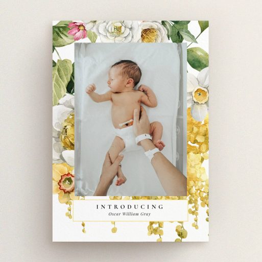 Floral design birth announcement card with one baby photo and elegant typography.