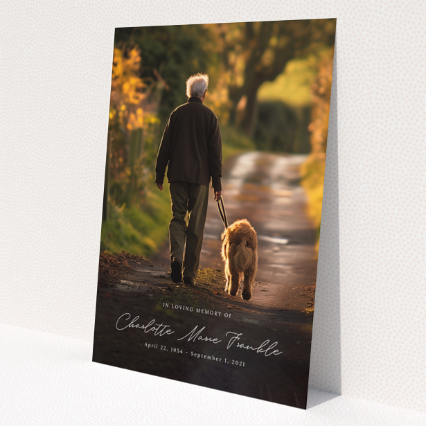 Funeral announcement design with one photo of a person walking a dog on a path