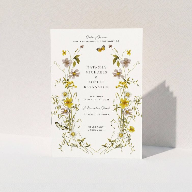 Floral wedding order of service program design with butterflies and two photo placeholders on a cream background.