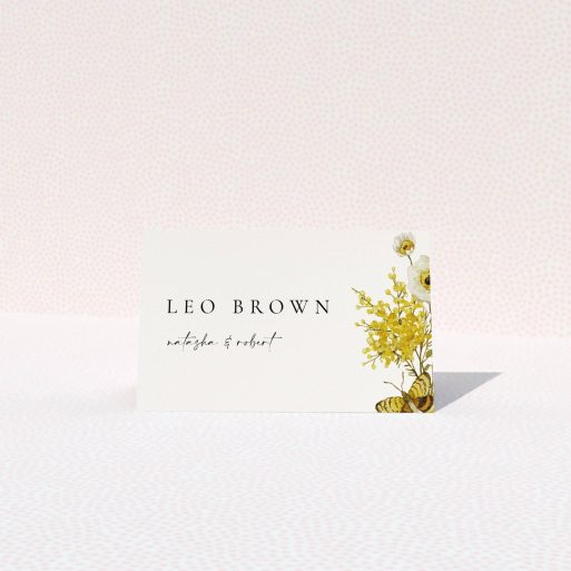 Floral wedding table place card with elegant typography and decorative yellow flowers and butterfly design