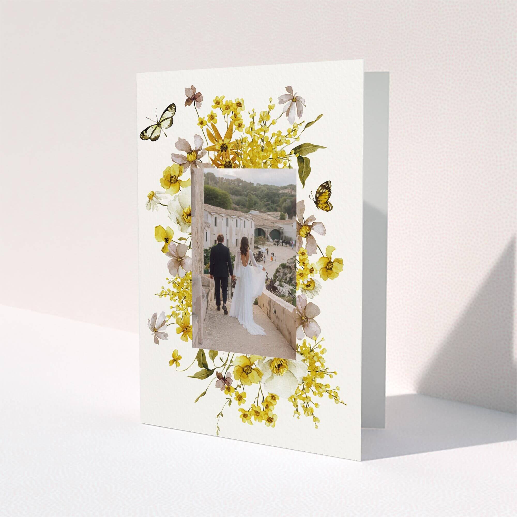 Elegant wedding thank you card design with one central photo surrounded by yellow floral accents.