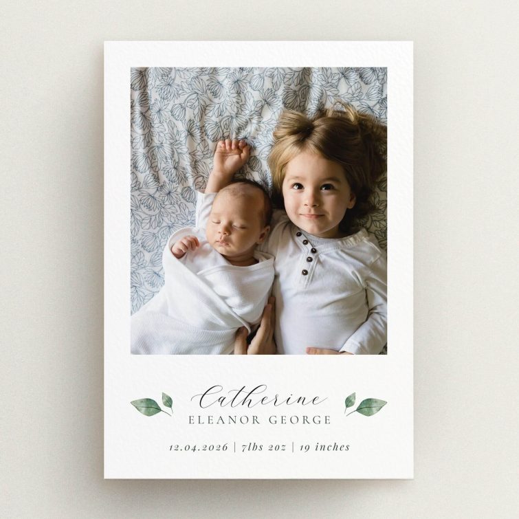 Two-photo birth announcement card design with floral accents and elegant typography.