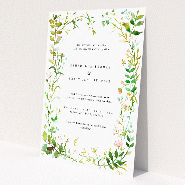 'Greenwich Garden wedding invitation featuring lush greenery and floral illustration in soft watercolour hues, capturing nature's beauty and promising a celebration blooming with love and joyous anticipation.'. This is a view of the front