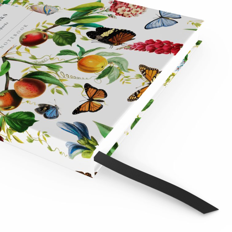 Colourful floral and butterfly design on portrait notebook cover, featuring two photos, ideal for personalised stationery.