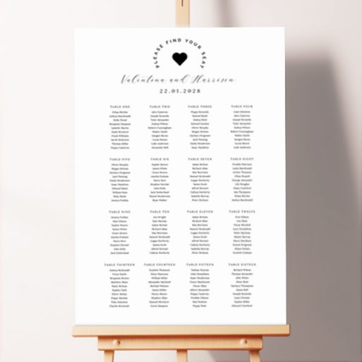 Romantic seating plan design named "Heart of the Matter" featuring a black heart at the top of the board surrounded by the text "Please Take Your Seat," adding a touch of elegance and romance to your wedding celebration.. This one shows 16 tables.