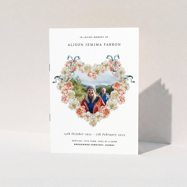 Floral heart design funeral order of service program with two memorial photographs
