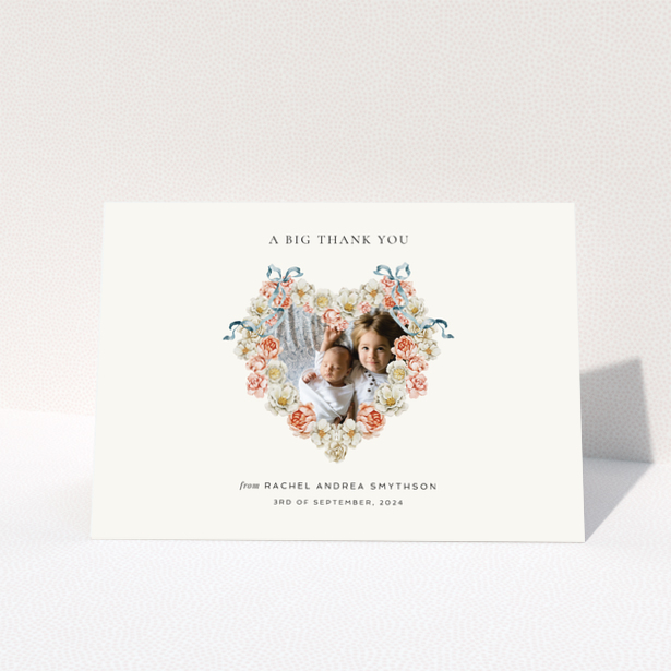 Baby thank you card with floral heart design featuring two photos