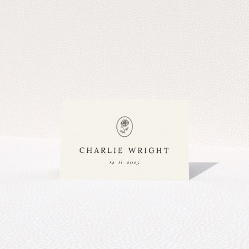 Heritage Crest place cards featuring minimalist design with a warm beige border and heraldic crest-like icon. This is a view of the front