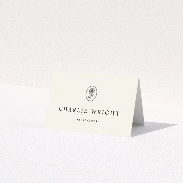 Heritage Crest place cards featuring minimalist design with a warm beige border and heraldic crest-like icon. This is a view of the front