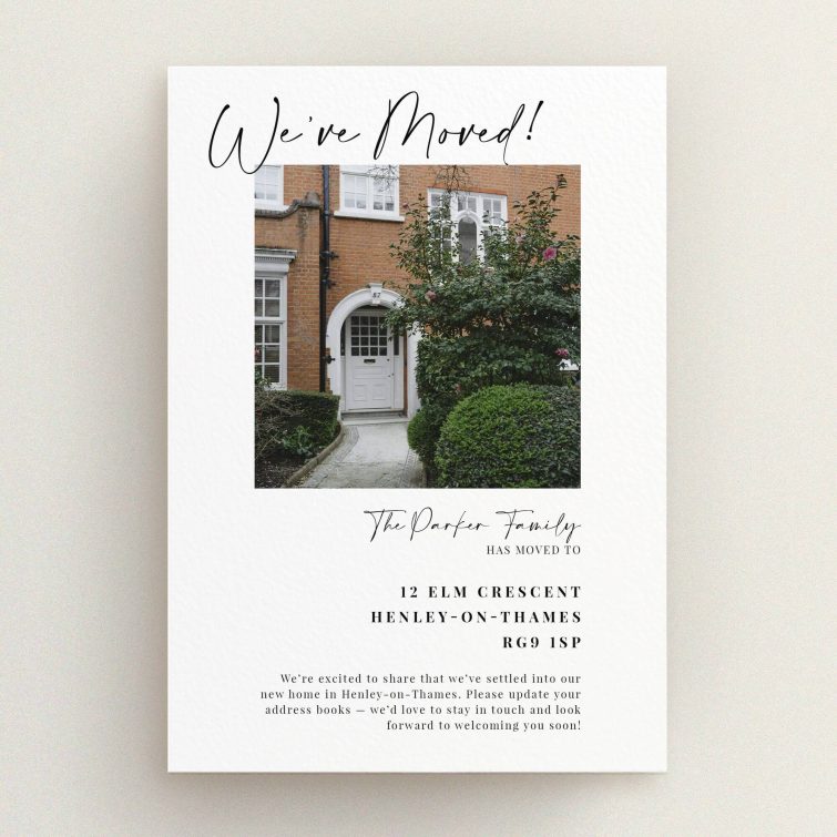Elegant change of address card design with photo of new home exterior.