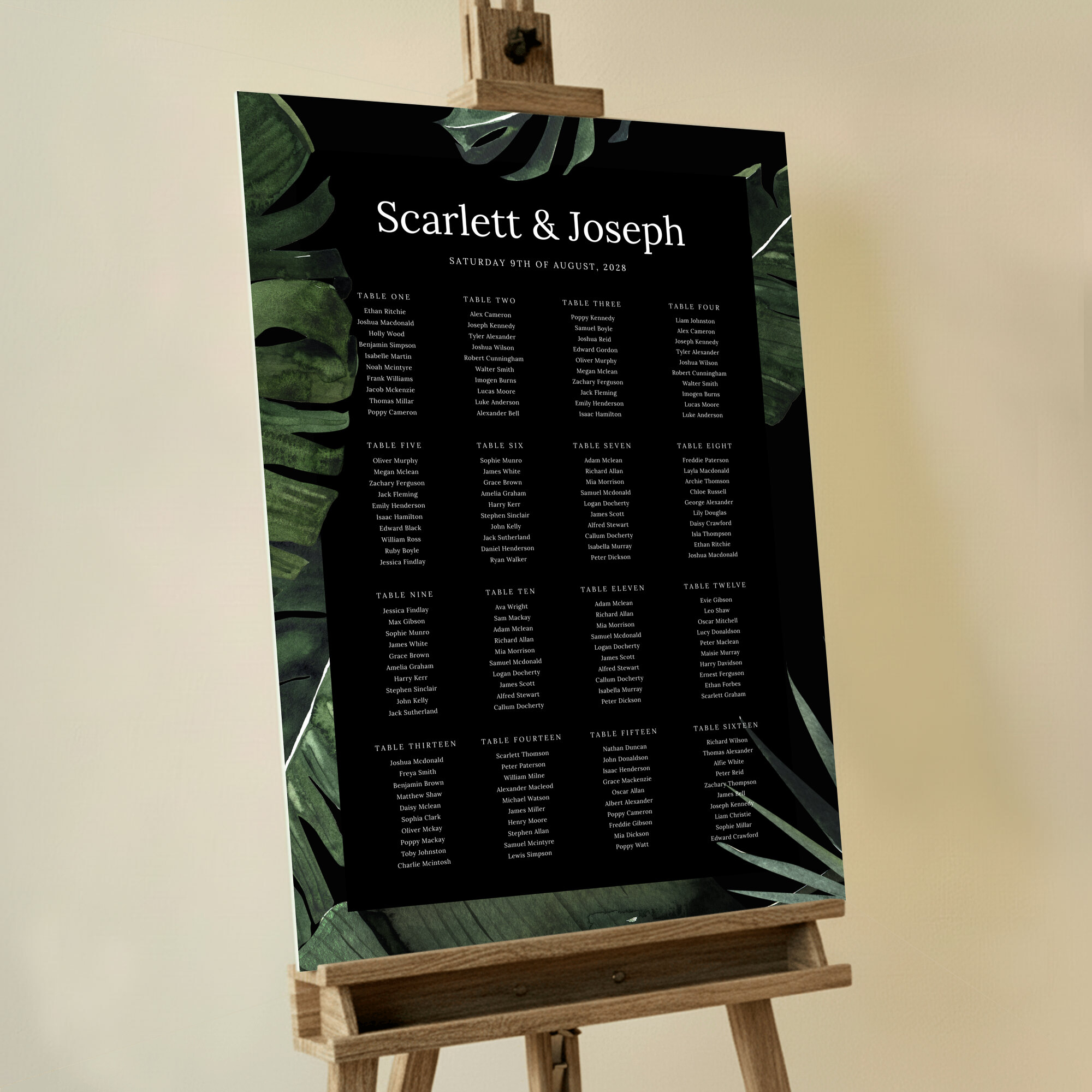 Foamex Jungle Nights Seating Plans featuring a dark and moody design with a border of large jungle leaves in dark green on a black background, adding a touch of mysterious sophistication to your special day, perfect for a nighttime celebration.. This template is formatted for 16 tables.