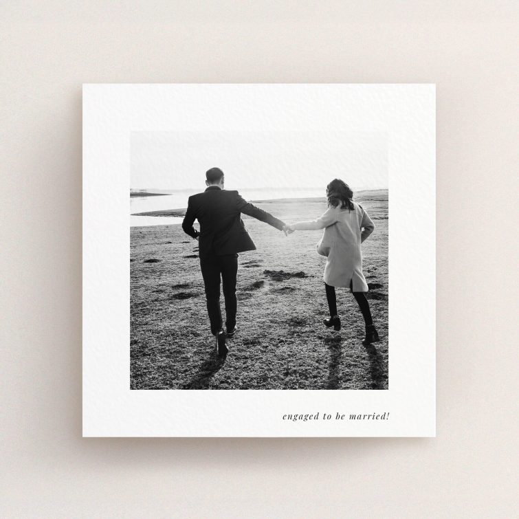 Romantic black and white engagement party invitations with one couple photo.