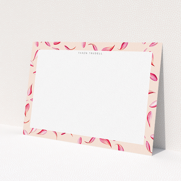 A ladies custom writing stationery design titled "Petal confetti". It is an A5 card in a landscape orientation. "Petal confetti" is available as a flat card, with tones of pink, red and white.