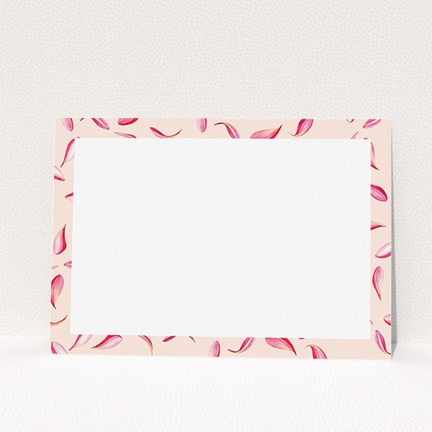 A ladies custom writing stationery design titled "Petal confetti". It is an A5 card in a landscape orientation. "Petal confetti" is available as a flat card, with tones of pink, red and white.