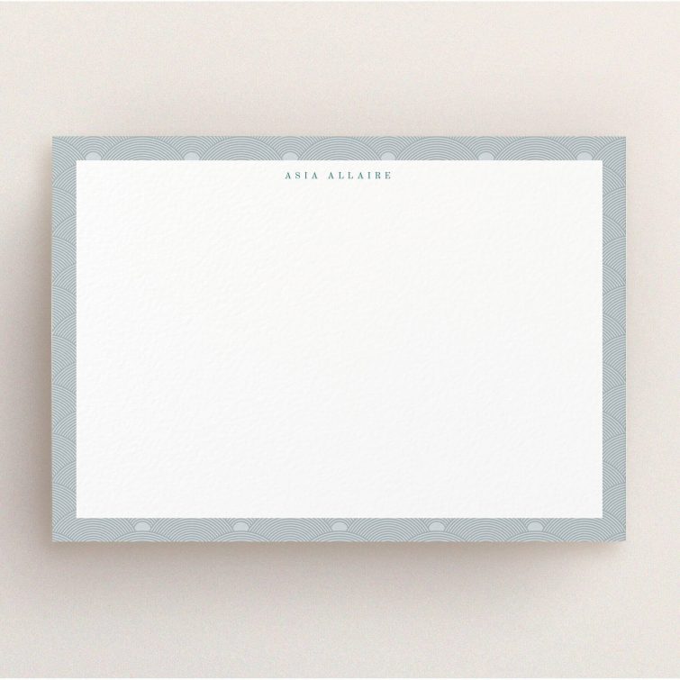 A ladies personalised note card design titled "Discs at dawn". It is an A5 card in a landscape orientation. "Discs at dawn" is available as a flat card, with tones of grey and blue.