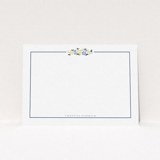 A ladies personalised note card design named "Surrounded by flowers". It is an A6 card in a landscape orientation. "Surrounded by flowers" is available as a flat card, with tones of white and blue.