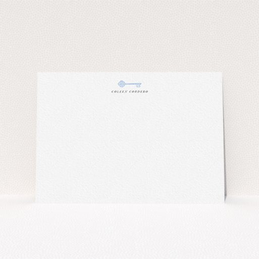 A ladies personalised note card design called "The magic key". It is an A6 card in a landscape orientation. "The magic key" is available as a flat card, with tones of white and blue.