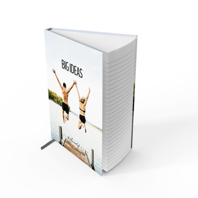 Portrait orientation notebook design with one photo of a couple jumping into a lake, showcasing a vibrant outdoor scene.