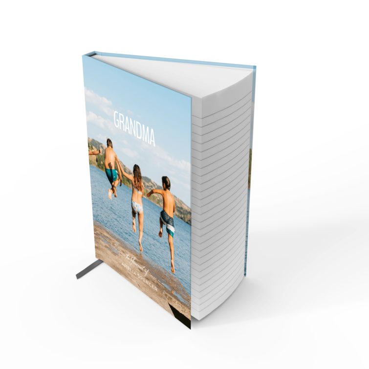 Personalised notebook cover design with photo of four people jumping into a lake, ideal for gifts and photo printing.