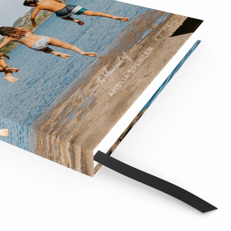 Personalised notebook cover design with photo of four people jumping into a lake, ideal for gifts and photo printing.