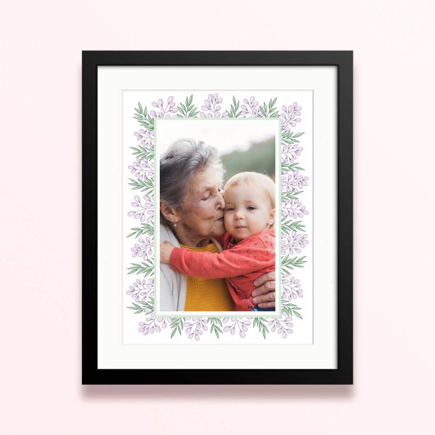 Framed and mounted photo print with floral border and one photo.