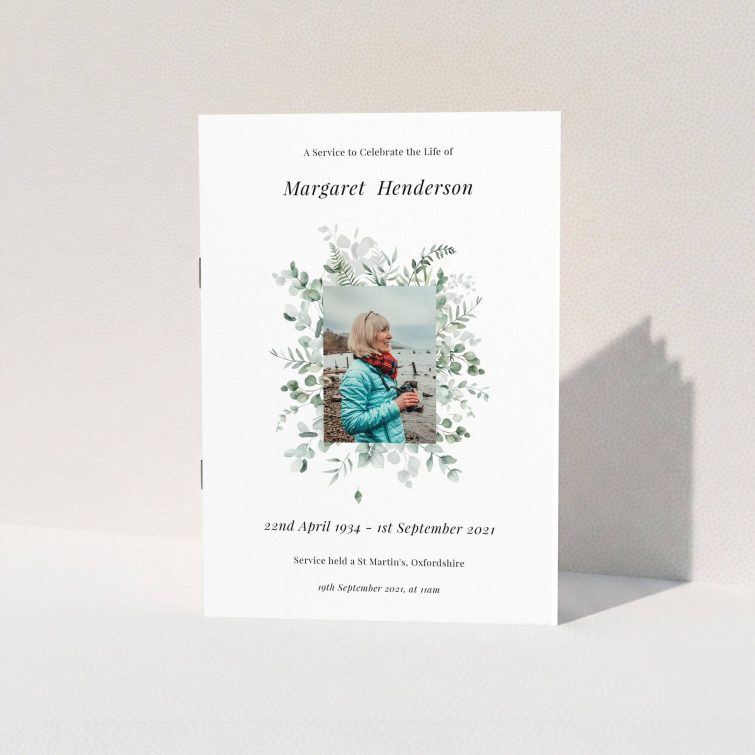 Floral funeral order of service program design with one photo, featuring elegant typography and greenery accents.