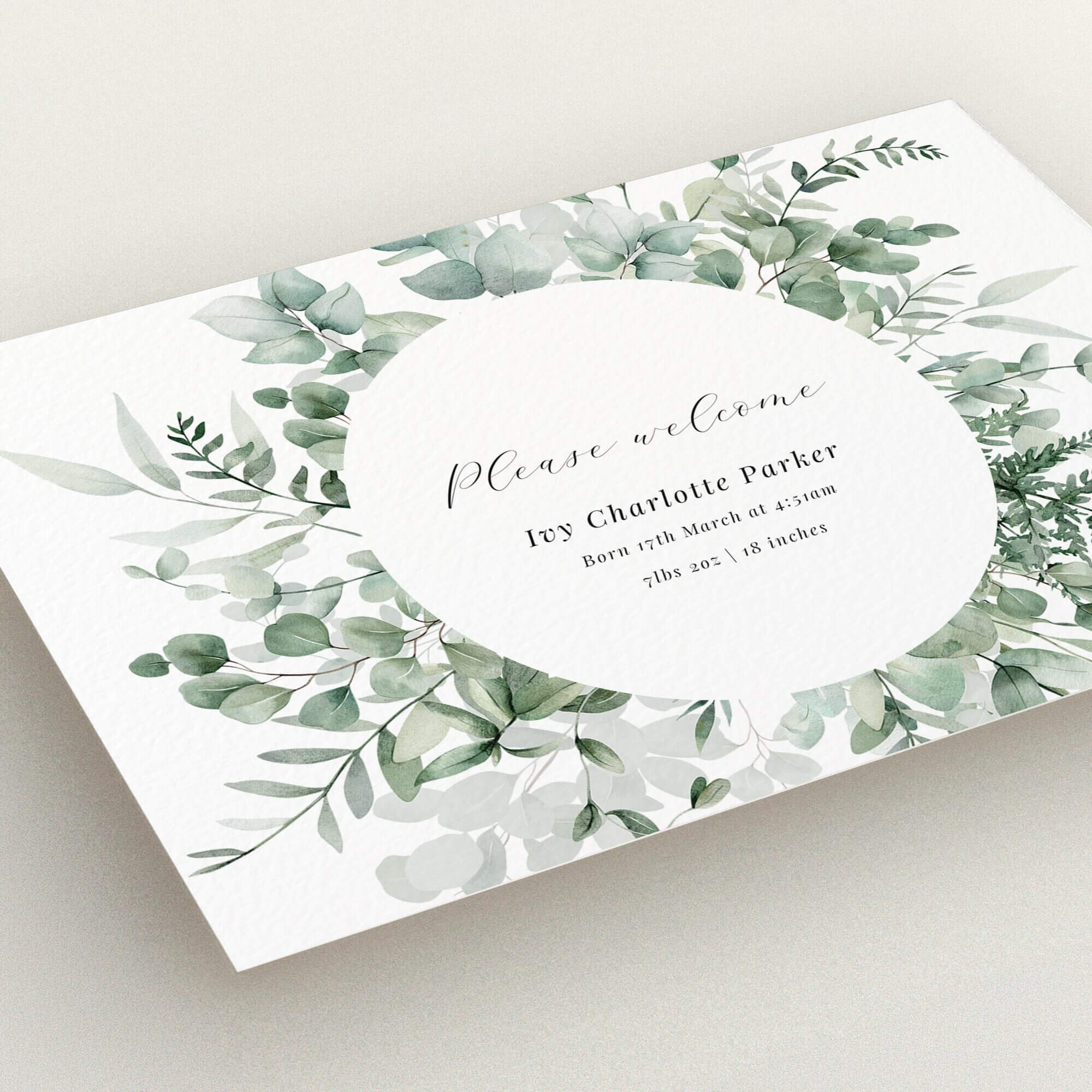 Elegant floral birth announcement card design with leafy wreath and personalised text
