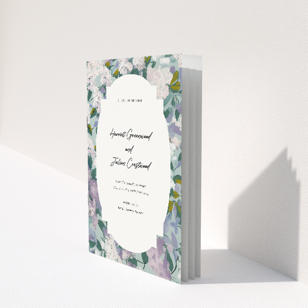 "Lilac Blossom wedding order of service booklet featuring graceful array of lilac and greenery, ideal for refined ceremonies with a touch of spring's tranquillity.". This image shows the front and back sides together