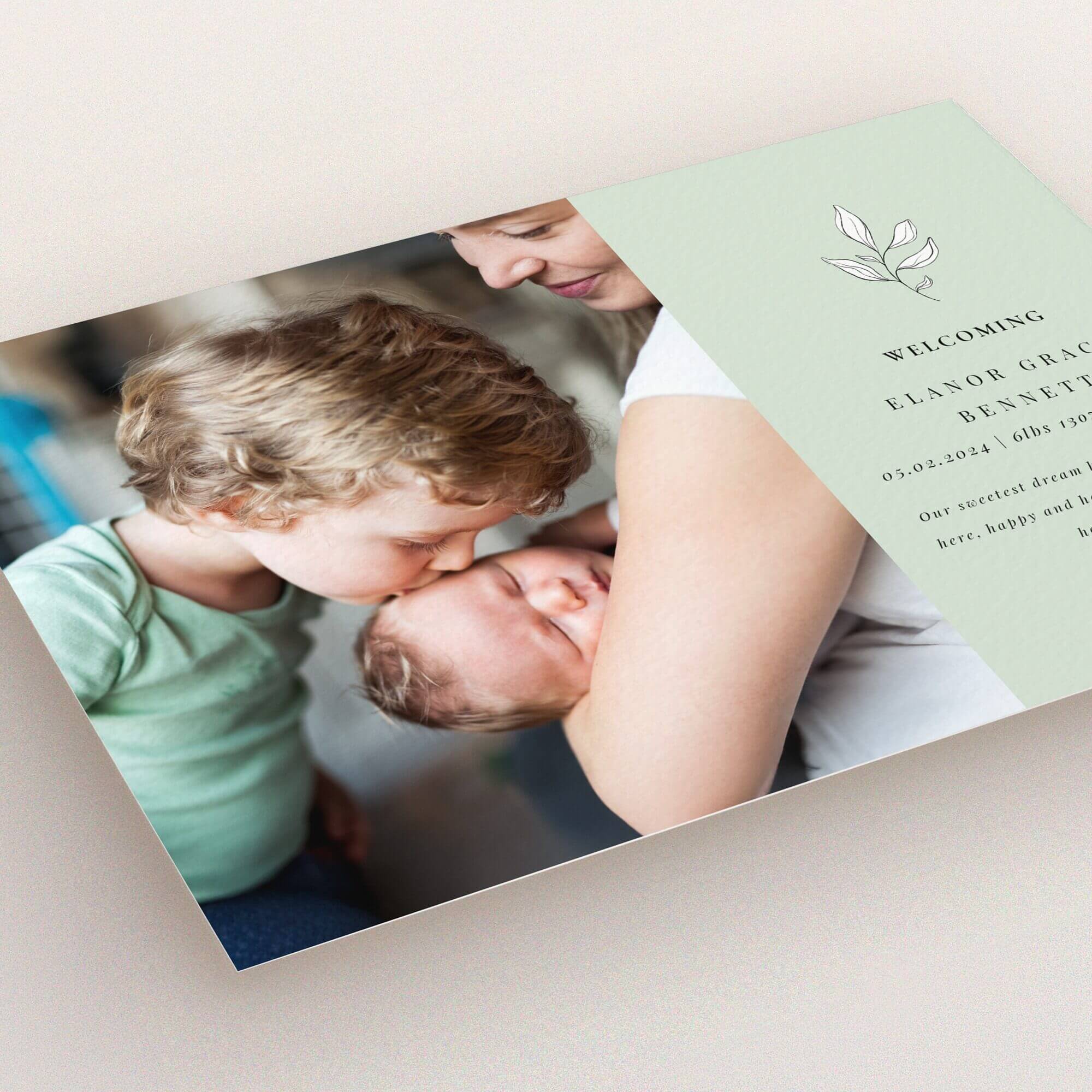 Birth announcement card with one photo featuring family and welcoming text design.
