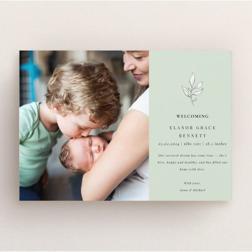 Birth announcement card with one photo featuring family and welcoming text design.