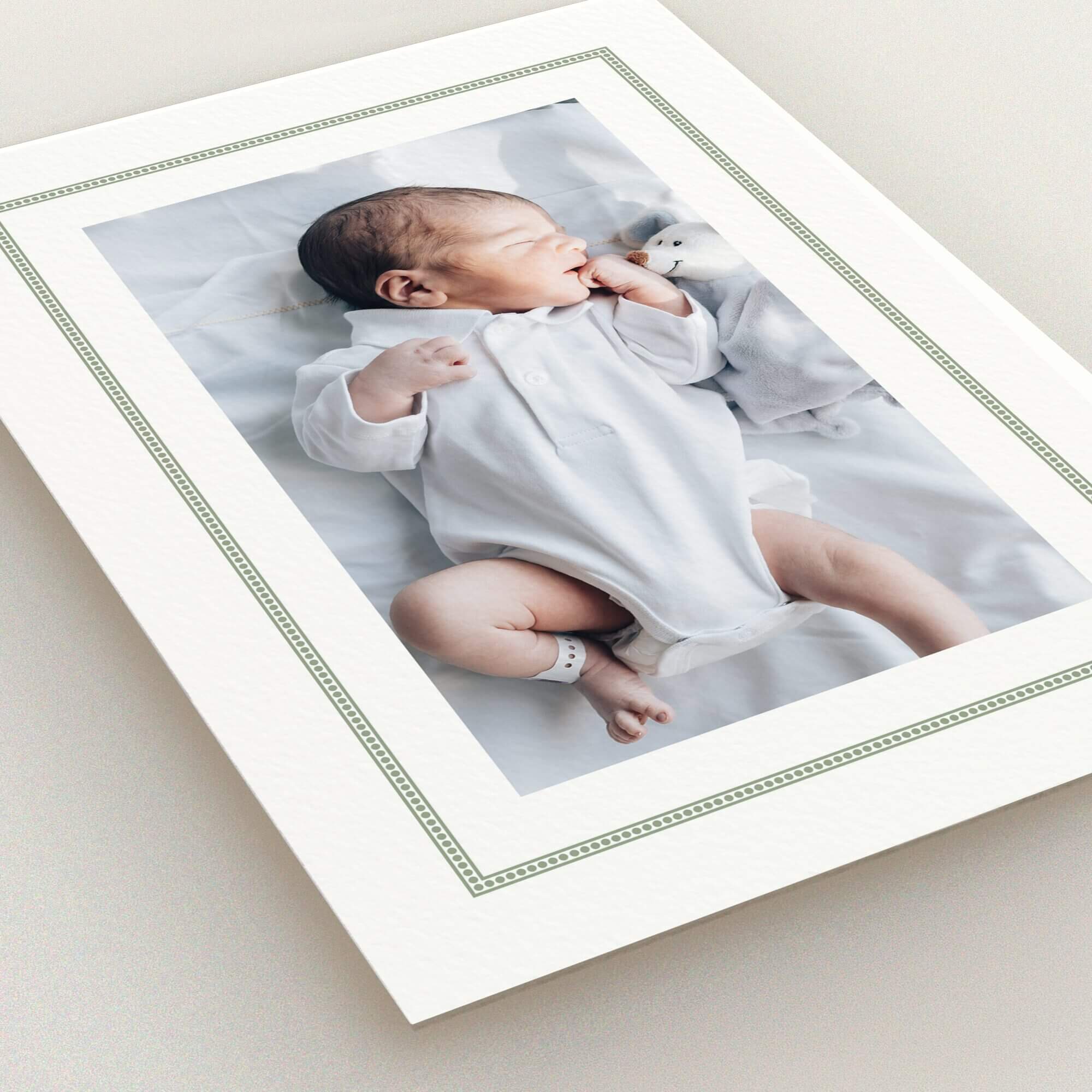 Birth announcement card design featuring one photo of a baby in white attire.