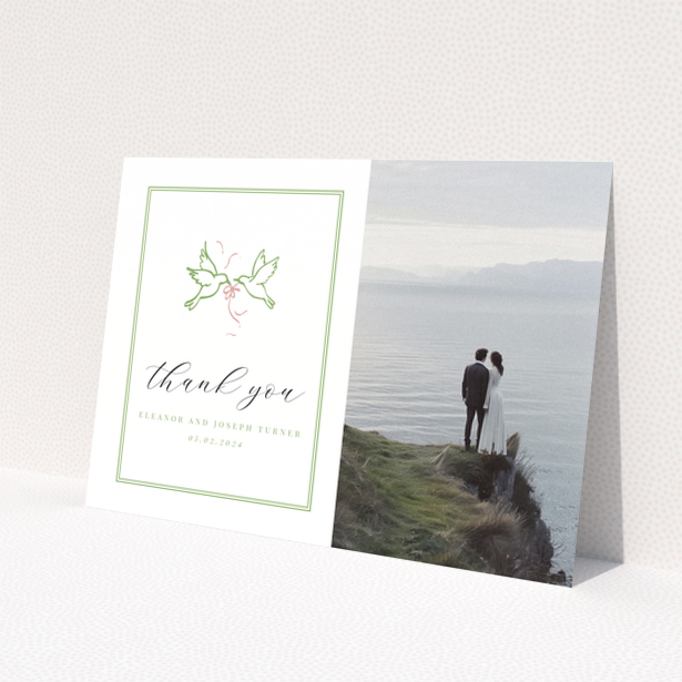 Thank you wedding card with photo of couple standing by the sea.