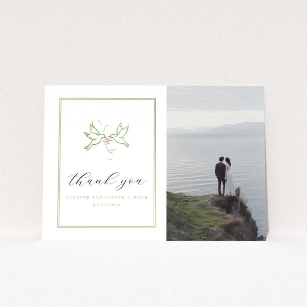 Thank you wedding card with photo of couple standing by the sea.