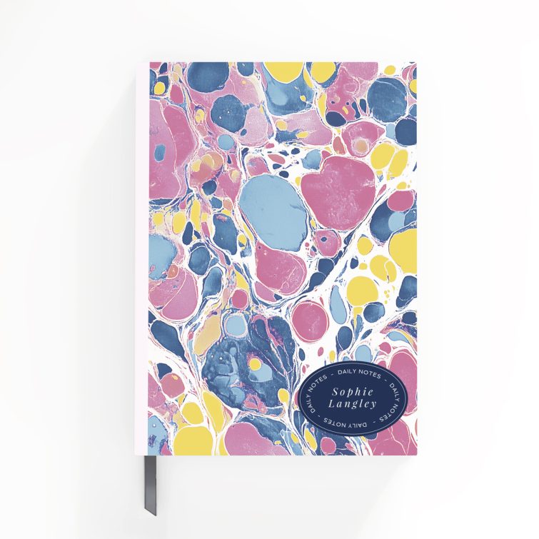 Colourful marbled design for personalised notebooks with space for daily notes and name.