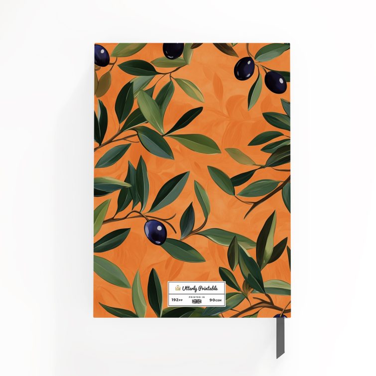 Floral orange notebook cover design with olive branch pattern, featuring two decorative photo elements.