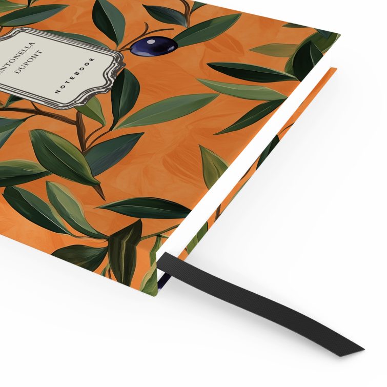 Floral orange notebook cover design with olive branch pattern, featuring two decorative photo elements.