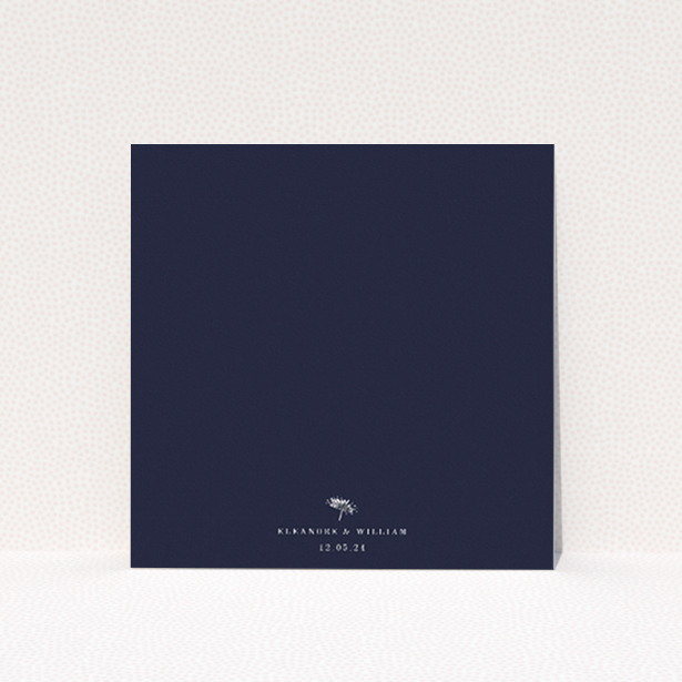 "Midnight Mayfair Florals" wedding invitation featuring a white botanical illustration on a deep navy background, evoking the allure of a starlit evening This image shows the front and back sides together