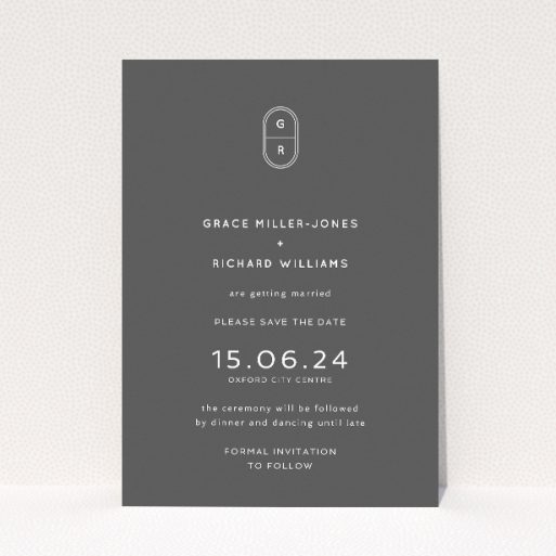 Midnight Monogram wedding save the date card with elegant monogram and contemporary typography on deep charcoal backdrop. This is a view of the front