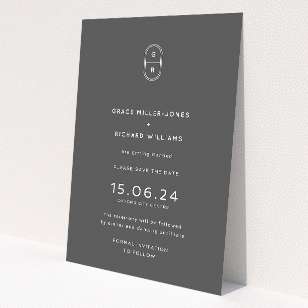 Midnight Monogram wedding save the date card with elegant monogram and contemporary typography on deep charcoal backdrop. This is a view of the back