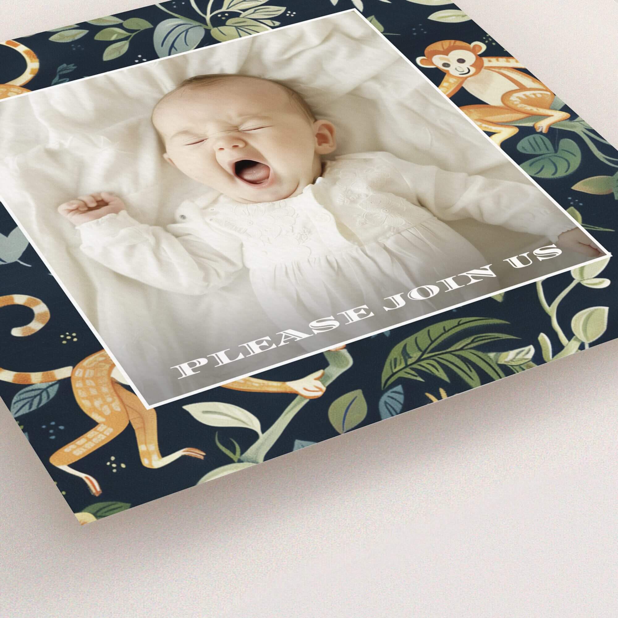 Christening invitation design featuring a baby photo and monkey pattern with floral elements