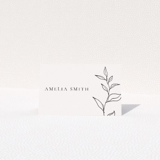 Monogram Floral Chic place cards - Sleek and stylish wedding stationery with minimalist elegance and botanical grace, featuring a bespoke monogram intertwined with a simple yet beautiful line-drawn sprig, rendered in sophisticated black on crisp white This is a view of the front