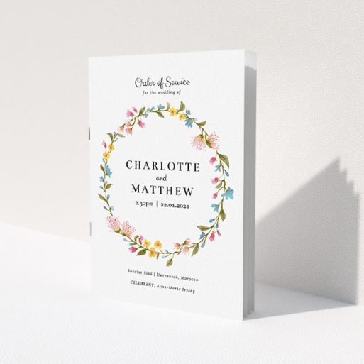 A multipage wedding order of service template titled 'Spring Wedding Wreath'. It is an A5 booklet in a portrait orientation. 'Spring Wedding Wreath' is available as a folded booklet booklet, with mainly pink colouring.