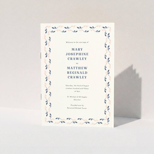 A multipage wedding order of service design named "Swimming in the garden". It is an A5 booklet in a portrait orientation. "Swimming in the garden" is available as a folded booklet booklet, with tones of cream, pink and navy blue.